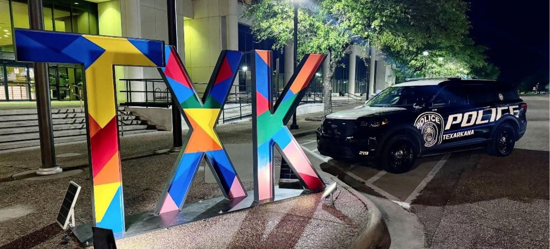 Texarkana Police Car and the TXK multicolored sign
